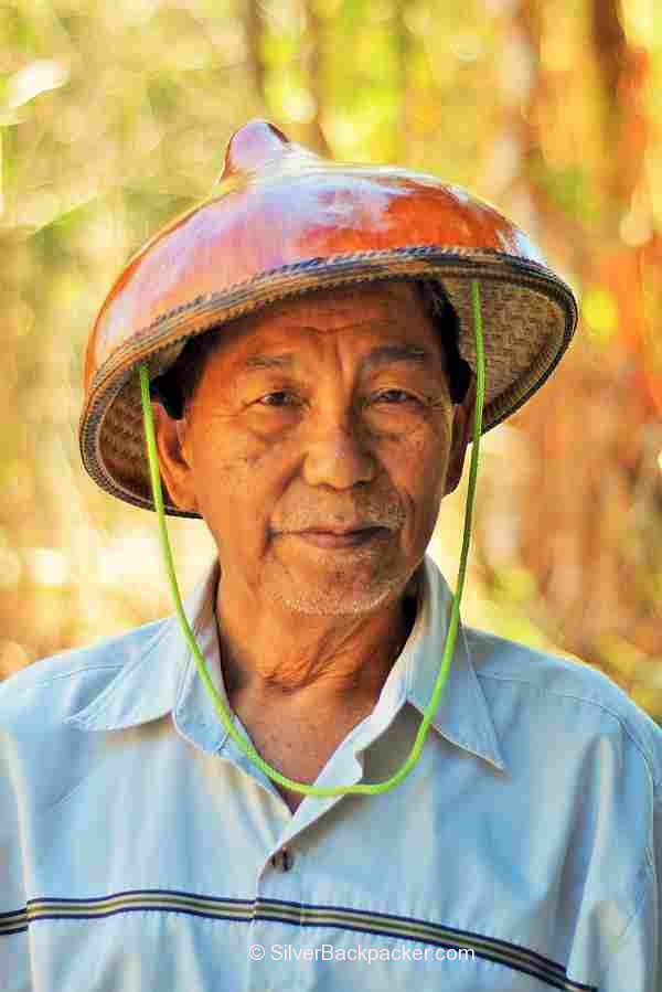 Teofilo Garcia Tabungaw Hat Maker, San Quintin, Abra, Philippines wearing a gourd hat