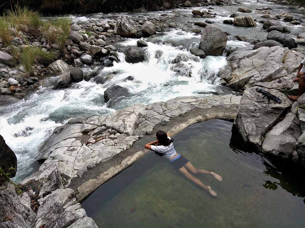 Kili Falls and hotspring. Bathing in hot water.