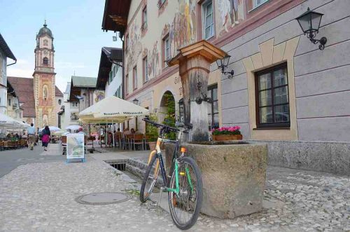Park up in picturesque towns like Mittenwald, Germany on a cycling holiday