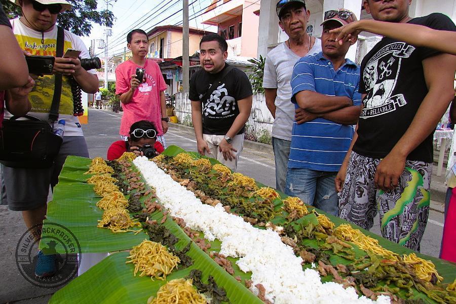 Paoay Tourism Officer explaining the budol fight feast at the Guling-Guling Festival