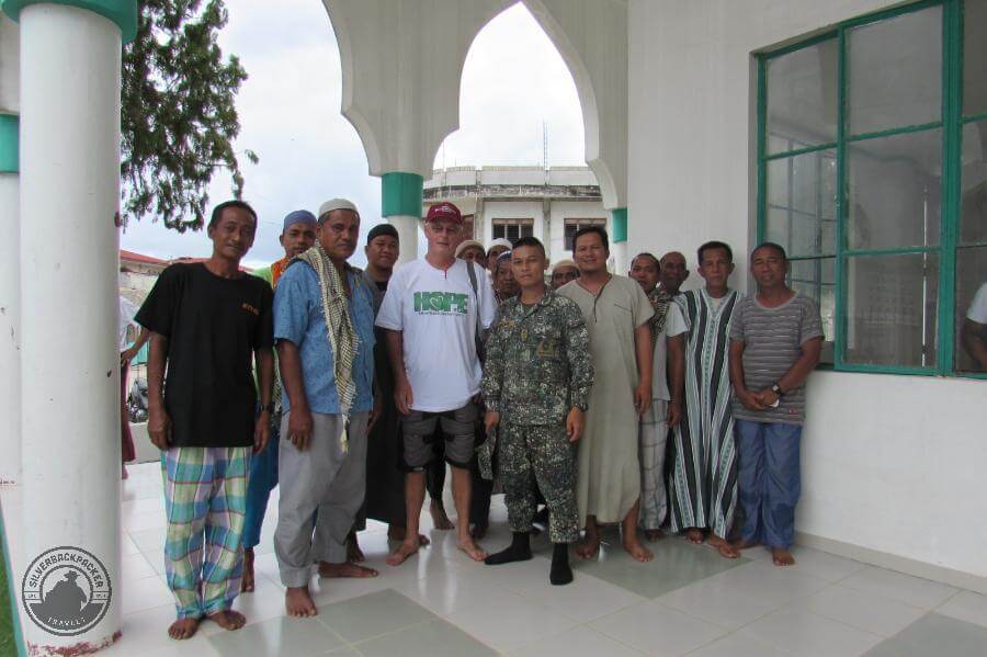 Silverbackpacker with a group of local islanders at the mosque