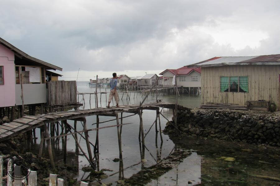 a walkway between houses on Simunul Island