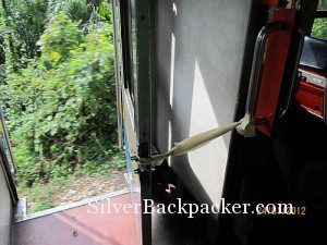 Train to Kuala Lipis door tied open letting in plenty of fresh air