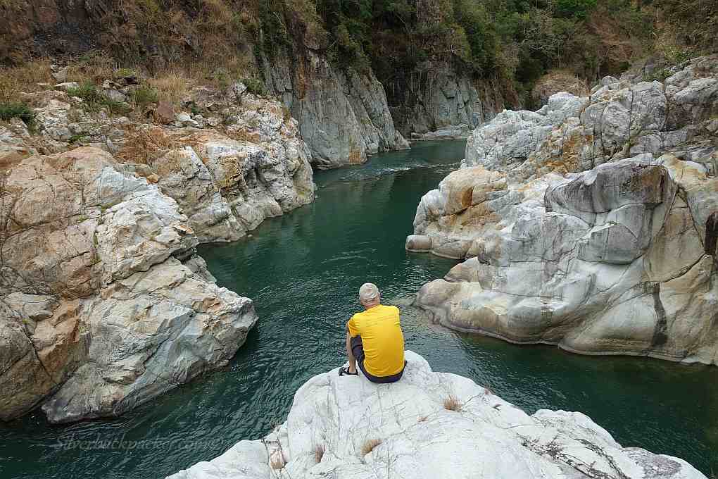 Sitting on Cliff Jump Rock, Piwek Rock Formations, Binongan River, Alaoa, Tineg Abra Sitting on Cliff Jump Rock, Piwek Rock Formations, Binongan River, Alaoa, Tineg Abra